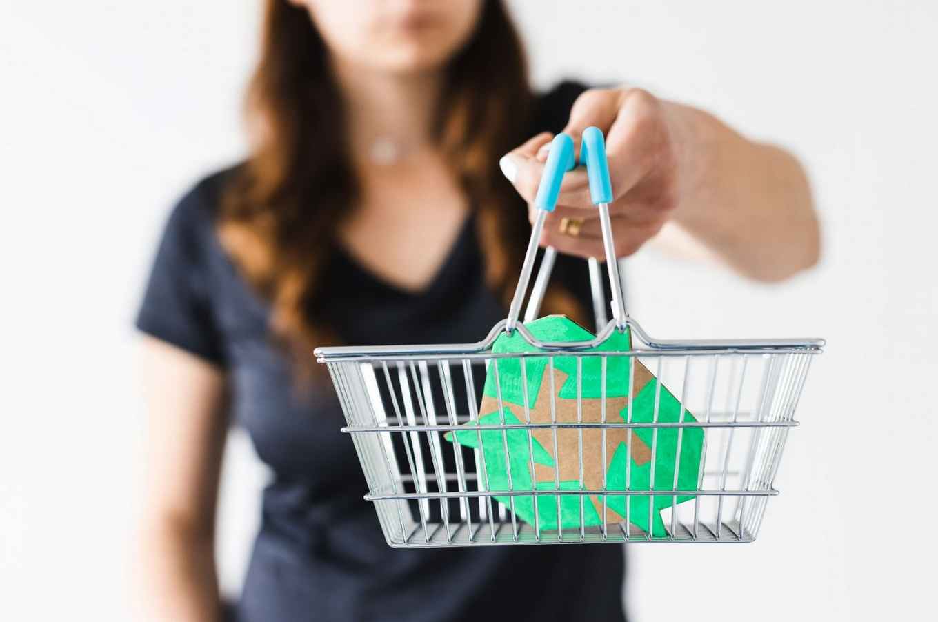 woman with shopping basket with sustainable brand